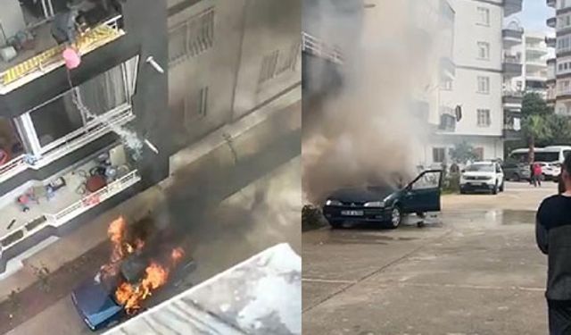 Mersin'de yanan otomobile balkondan kovayla müdahale-İzle